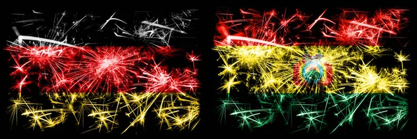 독일, 독일 vs 볼리비아, 볼리비아 새해 축하 여행 번쩍 이는 불꽃놀이 깃발 배경. 두 개의 추상 국가가 결합 된 깃발. — 스톡 사진
