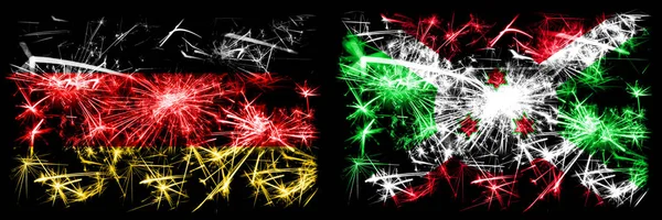 Deutschland, deutsch vs burundi, burundische Neujahrsfeier reisen funkelnde Feuerwerk Flaggen Konzept Hintergrund. Kombination aus zwei abstrakten Staaten Flaggen. — Stockfoto