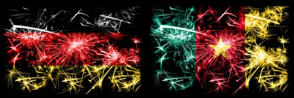 Deutschland, deutsch vs kamerun, kamerunische Neujahrsfeier reisen funkelnde Feuerwerk Flaggen Konzept Hintergrund. Kombination aus zwei abstrakten Staaten Flaggen. — Stockfoto