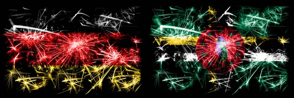 Deutschland, Deutschland vs Dominica Neujahrsfeier Reise funkelnden Feuerwerk Flaggen Konzept Hintergrund. Kombination aus zwei abstrakten Staaten Flaggen. — Stockfoto