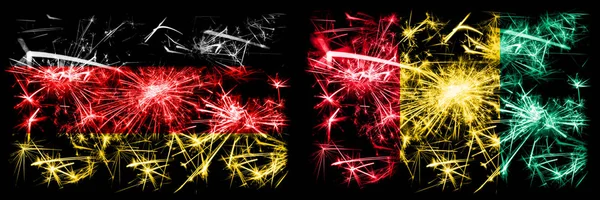Germania, Germania vs Guinea, festa di Capodanno guineano viaggiare scintillanti fuochi d'artificio bandiere concetto di sfondo. Combinazione di due bandiere di stati astratti . — Foto Stock