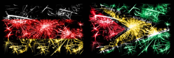 독일, 독일, 가이아나, 가이아나, 새해 기념행사는 불꽃 깃발 컨셉트 배경으로 진행 된다. 두 개의 추상 국가가 결합 된 깃발. — 스톡 사진