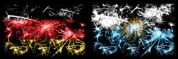 Germany, German vs San Marino, Sammarinese New Year celebration travel sparkling fireworks flags concept background. Combination of two abstract states flags.