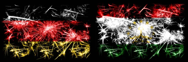 Deutschland, Deutschland vs Tadschikistan, tadschikische Neujahrsfeier Reise funkelnden Feuerwerk Flaggen Konzept Hintergrund. Kombination aus zwei abstrakten Staaten Flaggen. — Stockfoto