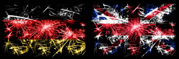 Germany, German vs United Kingdom, British, Britain New Year celebration travel sparkling fireworks flags concept background. Combination of two abstract states flags. — ストック写真