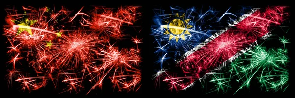 Κίνα, Κίνα εναντίον Ναμίμπια, Ναμίμπια Πρωτοχρονιά γιορτή ταξίδια αφρώδη πυροτεχνήματα σημαίες έννοια φόντο. Συνδυασμός δύο αφηρημένων κρατών σημαιών. — Φωτογραφία Αρχείου