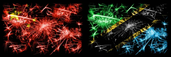 China, Chinese vs Tanzania, Tanzanian New Year celebration travel sparkling fireworks flags concept background. Combination of two abstract states flags. — Stock Photo, Image