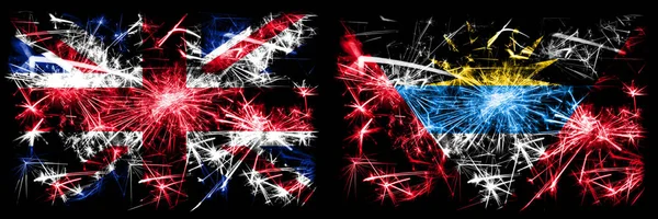 英国，英国对安提瓜和巴布达新年庆祝旅游闪耀烟花的概念背景。 两种抽象状态标志的组合. — 图库照片