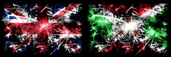 Nagy-Britannia, Egyesült Királyság vs Burundi, burundi újév ünneplés utazás pezsgő tűzijáték zászlók koncepció háttér. Két elvont állapot kombinációja zászló. — Stock Fotó