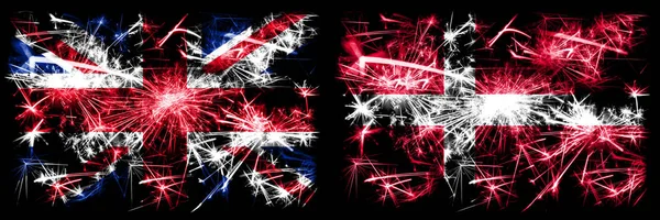 イギリス、イギリス対デンマーク、デンマークの新年のお祝い旅行輝く花火の旗のコンセプトの背景。2つの抽象的な状態フラグの組み合わせ. — ストック写真