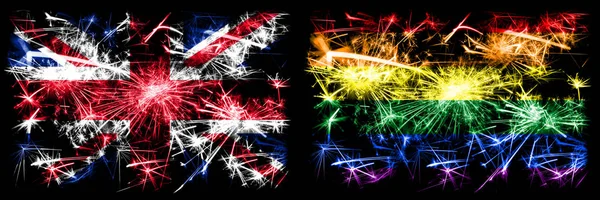 Great Britain, United Kingdom vs Gay pride New Year celebration travel sparkling fireworks flags concept background. Combination of two abstract states flags. — Stock Photo, Image