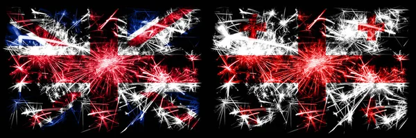 Велика Британія, Велика Британія проти Грузії, Грузинська подорож Нового року, що відзначає ігристі феєрверки, виблискує концепт-фон. Комбінація двох абстрактних держав прапори. — стокове фото