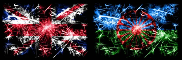 Nagy-Britannia, Egyesült Királyság vs cigány, római újév ünneplés utazás pezsgő tűzijáték zászlók koncepció háttér. Két elvont állapot kombinációja zászló. — Stock Fotó