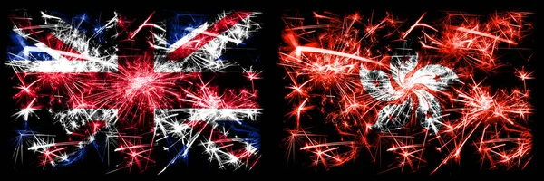 英国，英国对香港，中国新年庆祝旅游闪耀着烟花的概念背景。 两种抽象状态标志的组合. — 图库照片