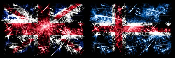 Велика Британія, Велика Британія проти Ісландії, ісландські новорічні екскурсії блищать феєрверки. Комбінація двох абстрактних держав прапори. — стокове фото