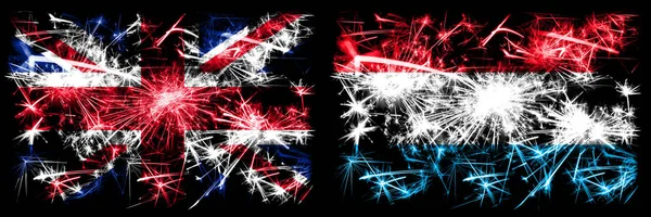 Gran Bretagna, Regno Unito vs Lussemburgo Capodanno celebrazione viaggio scintillanti fuochi d'artificio bandiere concetto di sfondo. Combinazione di due bandiere di stati astratti . — Foto Stock