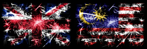 Great Britain, United Kingdom vs Malaysia, Malaysian New Year celebration travel sparkling fireworks flags concept background. Combination of two abstract states flags. — Stock Photo, Image