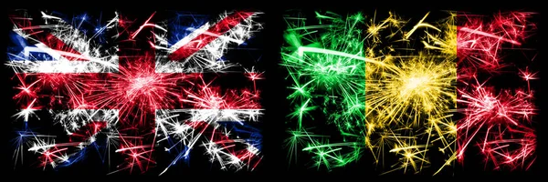 Great Britain, United Kingdom vs Mali New Year celebration travel sparkling fireworks flags concept background. Combination of two abstract states flags. — Stock Photo, Image