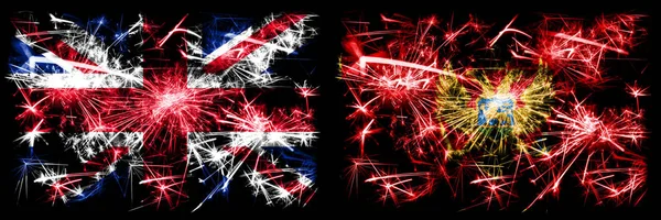 Great Britain, United Kingdom vs Montenegro, Montenegrin New Year celebration travel sparkling fireworks flags concept background. Combination of two abstract states flags.