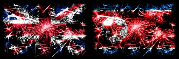 Great Britain, United Kingdom vs North Korea, Korean New Year celebration travel sparkling fireworks flags concept background. Combination of two abstract states flags. — ストック写真