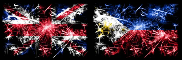 Great Britain, United Kingdom vs Philippines, Filipino New Year celebration travel sparkling fireworks flags concept background. Combination of two abstract states flags. — Stock Photo, Image