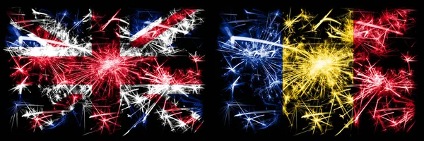 Storbritannien, Storbritannien vs Rumänien, Rumänska nyåret firande resa gnistrande fyrverkerier flaggor koncept bakgrund. Kombination av två abstrakta staters flaggor. — Stockfoto