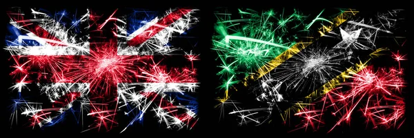 Great Britain, United Kingdom vs Saint Kitts and Nevis New Year celebration travel sparkling fireworks flags concept background. Combination of two abstract states flags. — Stock Photo, Image