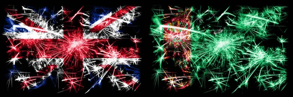Nagy-Britannia, Egyesült Királyság vs Türkmenisztán, Türkmenisztán Újév ünneplés utazás szikrázó tűzijáték zászlók koncepció háttér. Két elvont állapot kombinációja zászló. — Stock Fotó