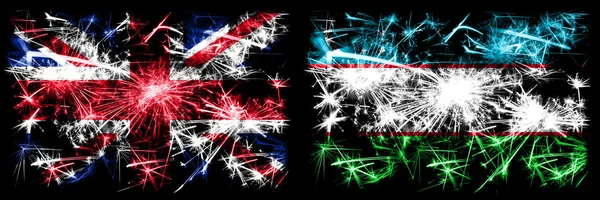 Wielka Brytania, Wielka Brytania vs Uzbekistan, uzbecki Nowy Rok obchody podróży musujące fajerwerki flagi tle koncepcja. Połączenie dwóch flag stanów abstrakcyjnych. — Zdjęcie stockowe