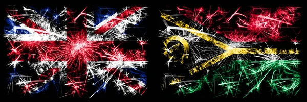 英国，英国对瓦努阿图新年庆祝旅游闪耀烟花的概念背景。 两种抽象状态标志的组合. — 图库照片