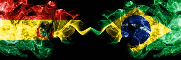 Bolivia, Bolivian vs Brazil, Brazilian smoky mystic states flags placed side by side. Concept and idea thick colored silky abstract smoke flags — Stock Photo, Image