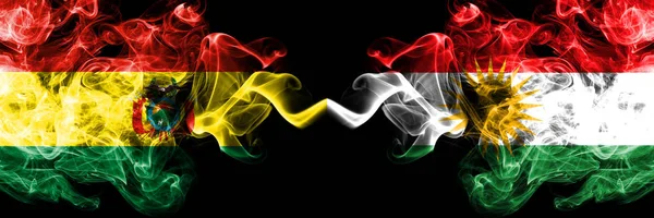 Bolivia, Bolivian vs Kurdistan, Kurdish smoky mystic states flags placed side by side. Concept and idea thick colored silky abstract smoke flags — Stock Photo, Image