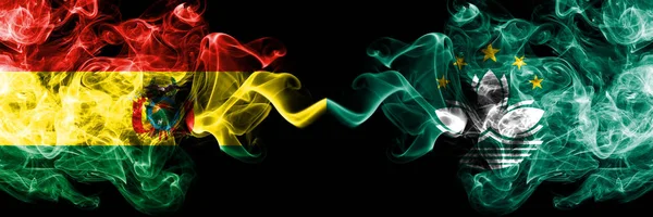 Bolivia, Bolivian vs Macau, China smoky mystic states flags placed side by side. Concept and idea thick colored silky abstract smoke flags — Stock Photo, Image