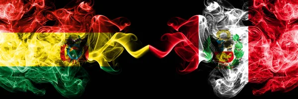 Bolivia, Bolivian vs Peru, Peruan smoky mystic states flags placed side by side. Concept and idea thick colored silky abstract smoke flags — Stock Photo, Image