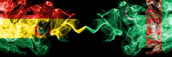 Bolivia, Bolivian vs Turkmenistan, Turkmenistans smoky mystic states flags placed side by side. Concept and idea thick colored silky abstract smoke flags — Stock Photo, Image