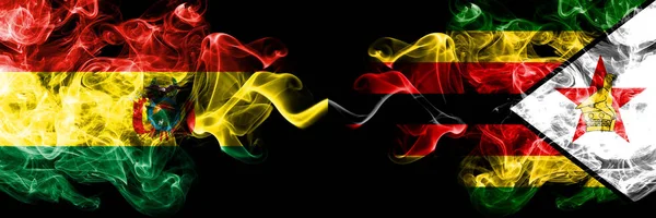 Bolivia, Bolivian vs Zimbabwe, Zimbabwean smoky mystic states flags placed side by side. Concept and idea thick colored silky abstract smoke flags — Stock Photo, Image