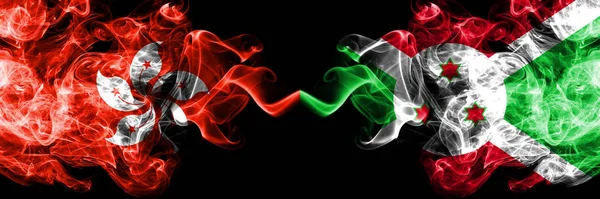 Hong Kong, China vs Burundi, Burundian smoky mystic states flags placed side by side. Concept and idea thick colored silky abstract smoke flags — Stock Photo, Image