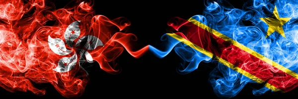 Hong Kong, China vs Democratic Republic of the Congo smoky mystic states flags placed side by side. Concept and idea thick colored silky abstract smoke flags — Stock Photo, Image