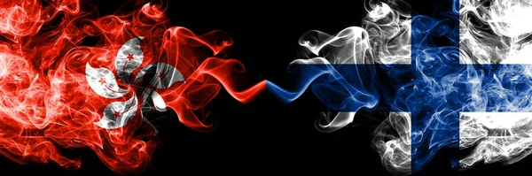 Hong Kong, China vs Finland, FInnish smoky mystic states flags placed side by side. Concept and idea thick colored silky abstract smoke flags