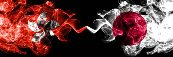 Hong Kong, China vs Japan, Japanese smoky mystic states flags placed side by side. Concept and idea thick colored silky abstract smoke flags — Stock Photo, Image