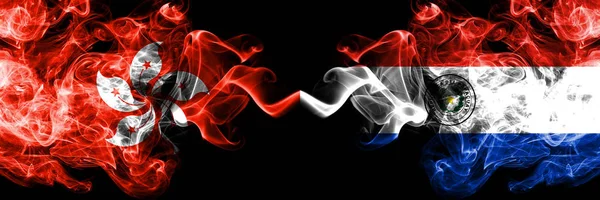 Hong Kong, China vs Paraguay, Paraguayan smoky mystic states flags placed side by side. Concept and idea thick colored silky abstract smoke flags — Stock Photo, Image