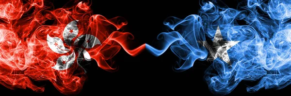 Hong Kong, China vs Somalia, Somalian smoky mystic states flags placed side by side. Concept and idea thick colored silky abstract smoke flags — Stock Photo, Image