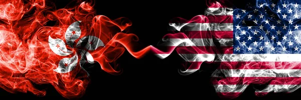 Hong Kong, China vs United States of America, American, USA smoky mystic states flags placed side by side. Concept and idea thick colored silky abstract smoke flags