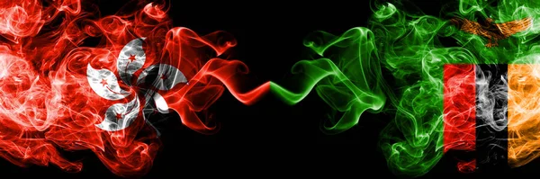 Hong Kong, China vs Zambia, Zambian smoky mystic states flags placed side by side. Concept and idea thick colored silky abstract smoke flags — Stock Photo, Image