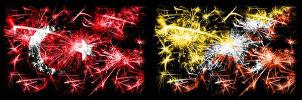 Turkije, Turks vs Bhutan, Bhutanese Nieuwjaar viering sprankelend vuurwerk vlaggen concept achtergrond. Combinatie van twee abstracte vlaggen. — Stockfoto