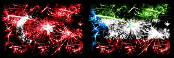 Turquía, Turquía vs Guinea Ecuatorial Año Nuevo celebración chispeante banderas de fuegos artificiales concepto de fondo. Combinación de dos banderas de estados abstractos . —  Fotos de Stock