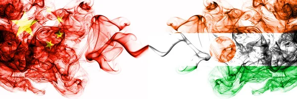 China, Chinese vs Niger, Nigerian smoky mystic states flags placed side by side. Concept and idea thick colored silky abstract smoke flags — Stock Photo, Image