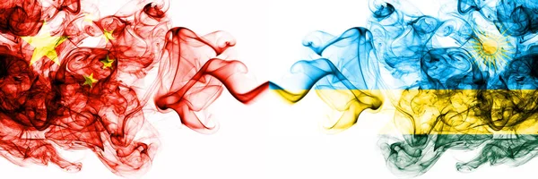 China, Chinese vs Rwanda, Rwandan smoky mystic states flags placed side by side. Concept and idea thick colored silky abstract smoke flags — Stock Photo, Image