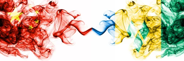 China, Chinese vs Saint Vincent and the Grenadines smoky mystic states flags placed side by side. Concept and idea thick colored silky abstract smoke flags — Stock Photo, Image