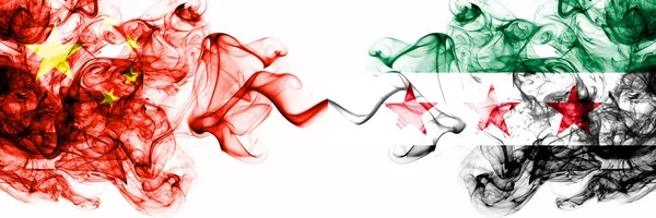 China, Chinese vs Syria, Syrian Arab Republic, opposition smoky mystic states flags placed side by side. Concept and idea thick colored silky abstract smoke flags